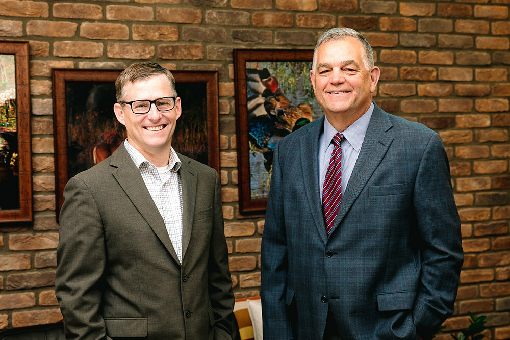Dr. Matthew Stinson, left, is succeeding Brooks Miller as president and CEO of Jordan Valley Community Health Center.