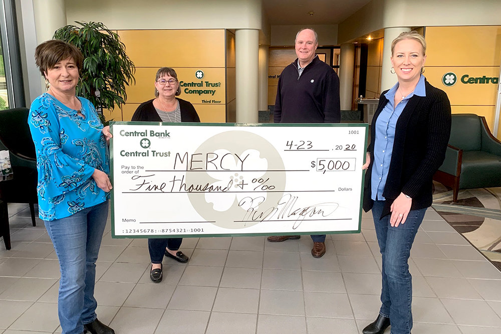 EMPLOYEE AID
Members of the Central Bank of the Ozarks private banking team prepare to donate $5,000 apiece to the employee assistance funds at Mercy Hospital Springfield and CoxHealth. Pictured, from left, with a check for Mercy is Kara Turner, Kathy Racz, Steve Gassel and Stephanie Murphy of Central Bank. “The daily life of a health care worker is truly one of sacrifice in the Springfield area,” bank officials wrote in a Facebook post about the donations.