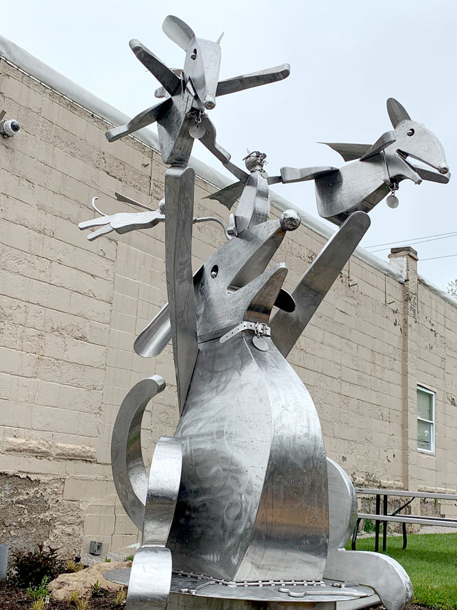 TO THE HEROES
The first piece of Sculpture Walk Springfield’s new collection was installed May 12 at Tie & Timber Beer Co. Titled “Do Some Good with your Superpowers,” local artist Doug Cox made the 8.5-foot stainless steel statue of dogs and cats wearing superhero capes. The installation was a change from Sculpture Walk’s plan to reveal the collection at the brewery’s May 5 Festival of Arts & Music, which was canceled due to the COVID-19 pandemic. Sculptures will now be installed one by one.