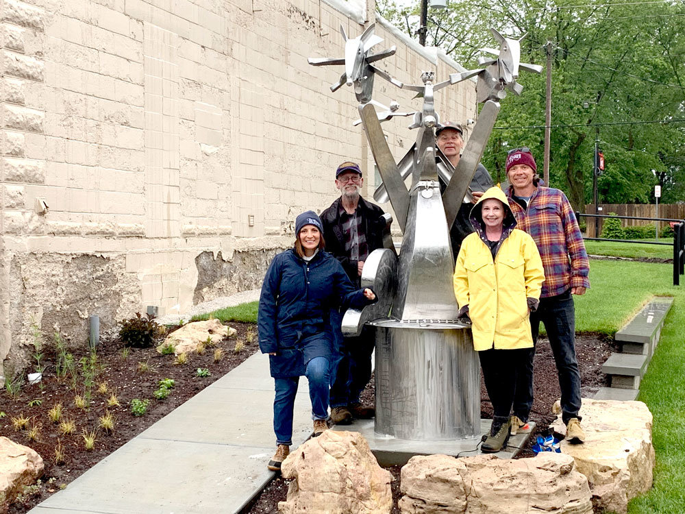 TO THE HEROES
The first piece of Sculpture Walk Springfield’s new collection was installed May 12 at Tie & Timber Beer Co. Titled “Do Some Good with your Superpowers,” local artist Doug Cox made the 8.5-foot stainless steel statue of dogs and cats wearing superhero capes. The installation was a change from Sculpture Walk’s plan to reveal the collection at the brewery’s May 5 Festival of Arts & Music, which was canceled due to the COVID-19 pandemic. Sculptures will now be installed one by one. 
From left to right, Tie & Timber co-owner Jennifer Leonard, artist Cox, Sculpture Walk board member Joe Malesky, Sculpture Walk Executive Director Tery O’Shell, and Sculpture Walk board member and Tie & Timber co-owner Curtis Marshall, with the statue.