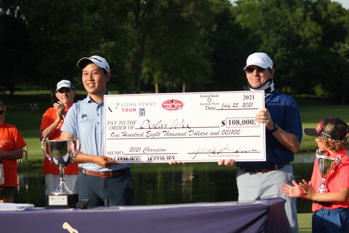 Dylan Wu is awarded the tournament-winning check at Highland Springs by Price Cutter's Rob Marsh.