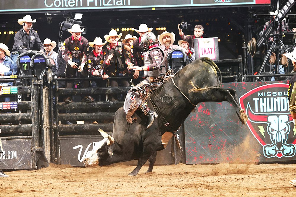 Colten Fritzlan with the Missouri Thunder holds on while a bull attempts to throw him off at a recent PBR Team Series event.